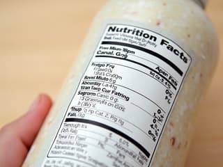 Close-up of a food label with key nutritional information highlighted, on a clean background