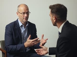 Studio portrait of a supportive man role-playing a conversation, professional setting